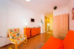 A television and/or entertainment centre at ALEGRIA ID33