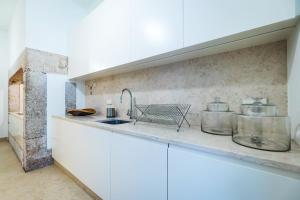 Kuchyň nebo kuchyňský kout v ubytování Santa Justa Prime Guesthouse + 30 fotografií