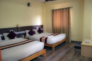 Postelja oz. postelje v sobi nastanitve HOTEL LUMA INN