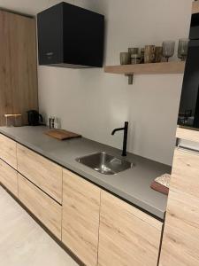 a kitchen with a sink and a counter top at Tiny Seven in Otterlo