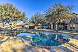a large pool in the yard of a house at Spacious Ranch in Argyle with Private Pool & Spa 