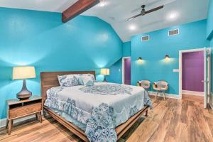 a blue bedroom with a bed and a wooden floor at Spacious Ranch in Argyle with Private Pool & Spa 