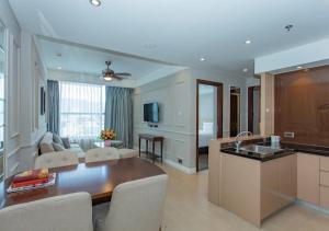 a large kitchen and living room with a table and chairs at Luxury Apartment in Sheraton Building with Ocean View in Da Nang