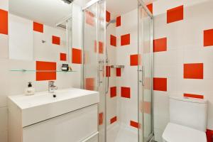 a bathroom with a sink and a shower at Ola Living MACBA in Barcelona