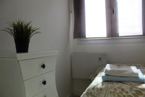 Łóżko lub łóżka w pokoju w obiekcie Apartamento Calle Huelva by CasaTuristica