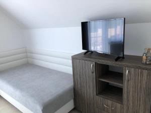 Posteľ alebo postele v izbe v ubytovaní Deluxe Apartments