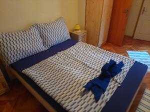 A bed or beds in a room at Ágnes Pihenőház