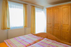 Un pat sau paturi într-o cameră la Aignerhof
