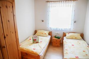 Un pat sau paturi într-o cameră la Aignerhof