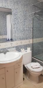 a bathroom with a sink and a toilet and a shower at Soldeu Paradis Pleta in Soldeu +83 photos
