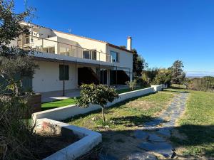 a house with a pathway in front of it at Le Domaine Vermeil in Argelès-sur-Mer