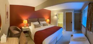 Ein Bett oder Betten in einem Zimmer der Unterkunft Caley Hall