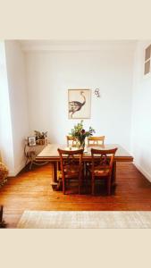 a dining room with a table and chairs at Maison de l'enfant gites in Goès