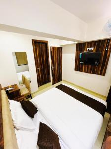Postel nebo postele na pokoji v ubytování Hotel Hilton Suites