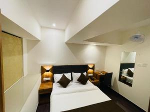 Postel nebo postele na pokoji v ubytování Hotel Hilton Suites