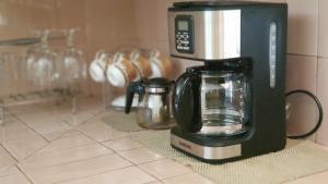 a coffee maker sitting on top of a counter at Apollo Capsule Hotel in Ende