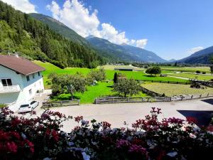 a view of a park with mountains in the background at Gästehaus Zwischenberger in Obervellach