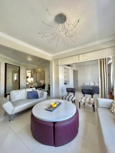 a living room with a couch and a table at Recoleta Luxury Apartment in Buenos Aires