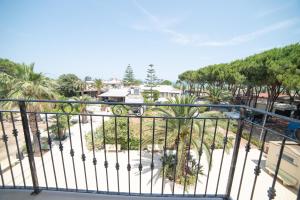 a view from the balcony of a resort with palm trees at Residence L'Africhetta in Rodi Garganico