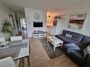 a living room with a couch and a table at Wohnung Nr. 1 Willingen in Willingen