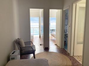 a living room with a view of the ocean at Thassa Beach Apartment No4 in Leonidio