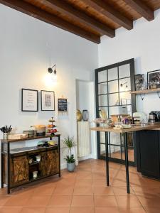 a kitchen with a table and a counter top at Il Cantuccio di Gioia in Brescia