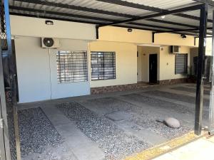 an outside view of an empty room with a building at Duplex Lisandro de la Torre in San Rafael
