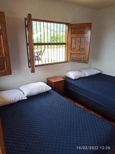 Posteľ alebo postele v izbe v ubytovaní Guadalupana