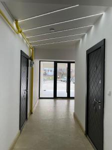 an empty hallway with doors in a building at City View Apartament in Iaşi