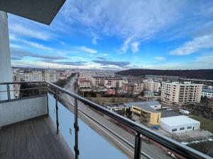 a balcony with a view of a city at City View Apartament in Iaşi