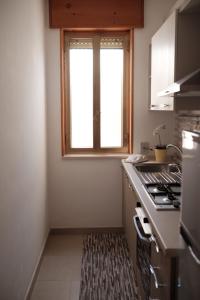 A kitchen or kitchenette at Appartamento Maestrale