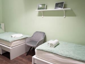 Posteľ alebo postele v izbe v ubytovaní Pajger Apartman Egyetemváros
