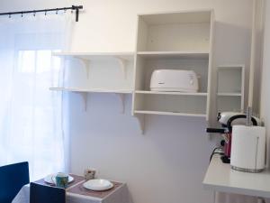 Kuchyňa alebo kuchynka v ubytovaní Pajger Apartman Egyetemváros