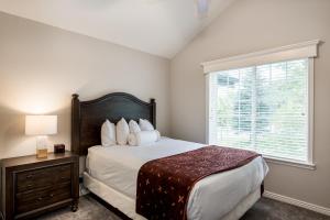 a bedroom with a large bed and a window at Family Getaway-Skiing, Ice Castles & Golf Course 2204 apts in Midway +11 photos