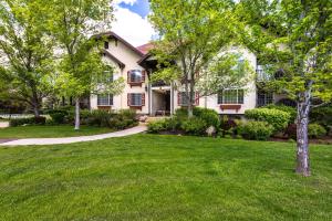 a house with a green lawn and trees at Family Getaway-Skiing, Ice Castles & Golf Course 2204 apts in Midway