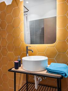 a bathroom with a sink and a mirror at Family House in Lakones in Paleokastritsa