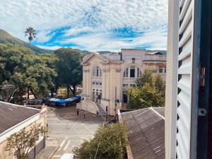 a view from a window of a building with a playground at Hotel Thermas da Mantiqueira - Poços de Caldas - De frente para a Praça Central in Poços de Caldas