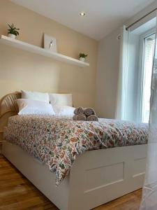 Posteľ alebo postele v izbe v ubytovaní Appartement cosy NANCY