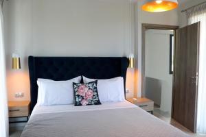 A bed or beds in a room at OLYMPUS Paradise 6