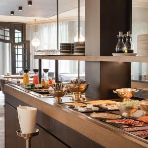 a kitchen with a counter with food on it at Hotel Britannia in Knokke-Heist