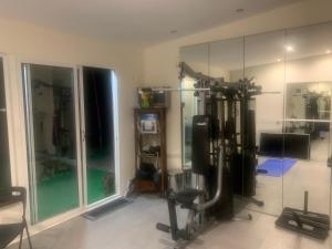 a room with a gym with a large glass wall at Tavira Unterkunft Entspannung pur!!! in Luz de Tavira