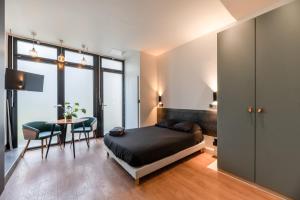 Posteľ alebo postele v izbe v ubytovaní Appartement Le Médicis - 2 chambres