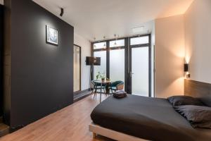 Posteľ alebo postele v izbe v ubytovaní Appartement Le Médicis - 2 chambres