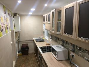 a kitchen with a counter with a toaster on it at FeelingHome Aparment - 3 bedrooms - Very Clean in Buzău