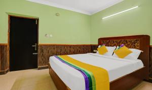 a bedroom with a large bed in a room at Itsy By Treebo - Rain Forest in Ooty