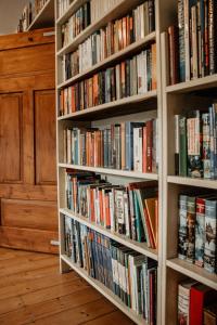a book shelf filled with lots of books at Ferienhaus Anno 1810 in Wadern