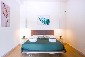 Postel nebo postele na pokoji v ubytování Rossani Suites&Aparts