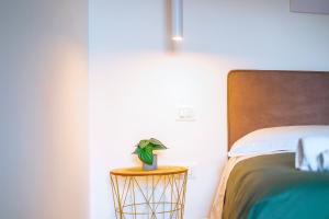 Postel nebo postele na pokoji v ubytování Rossani Suites&Aparts