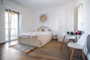Postel nebo postele na pokoji v ubytování Rossani Suites&Aparts