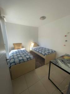 Ein Bett oder Betten in einem Zimmer der Unterkunft Appartement 60m2 à 15min de la plage